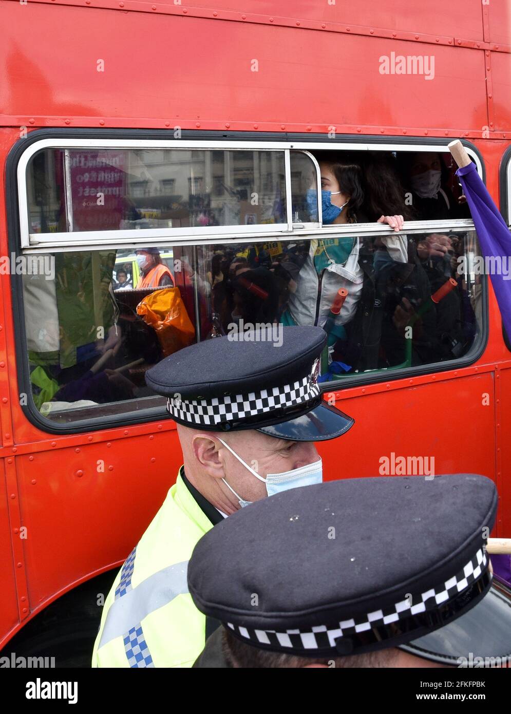 Trafalgar Square, London, UK. 1st May 2021. Kill the Bill protesters in Trafalgar Square.  Police try to stop a double decker bus from entering the square. Credit: Matthew Chattle/Alamy Live News Stock Photo