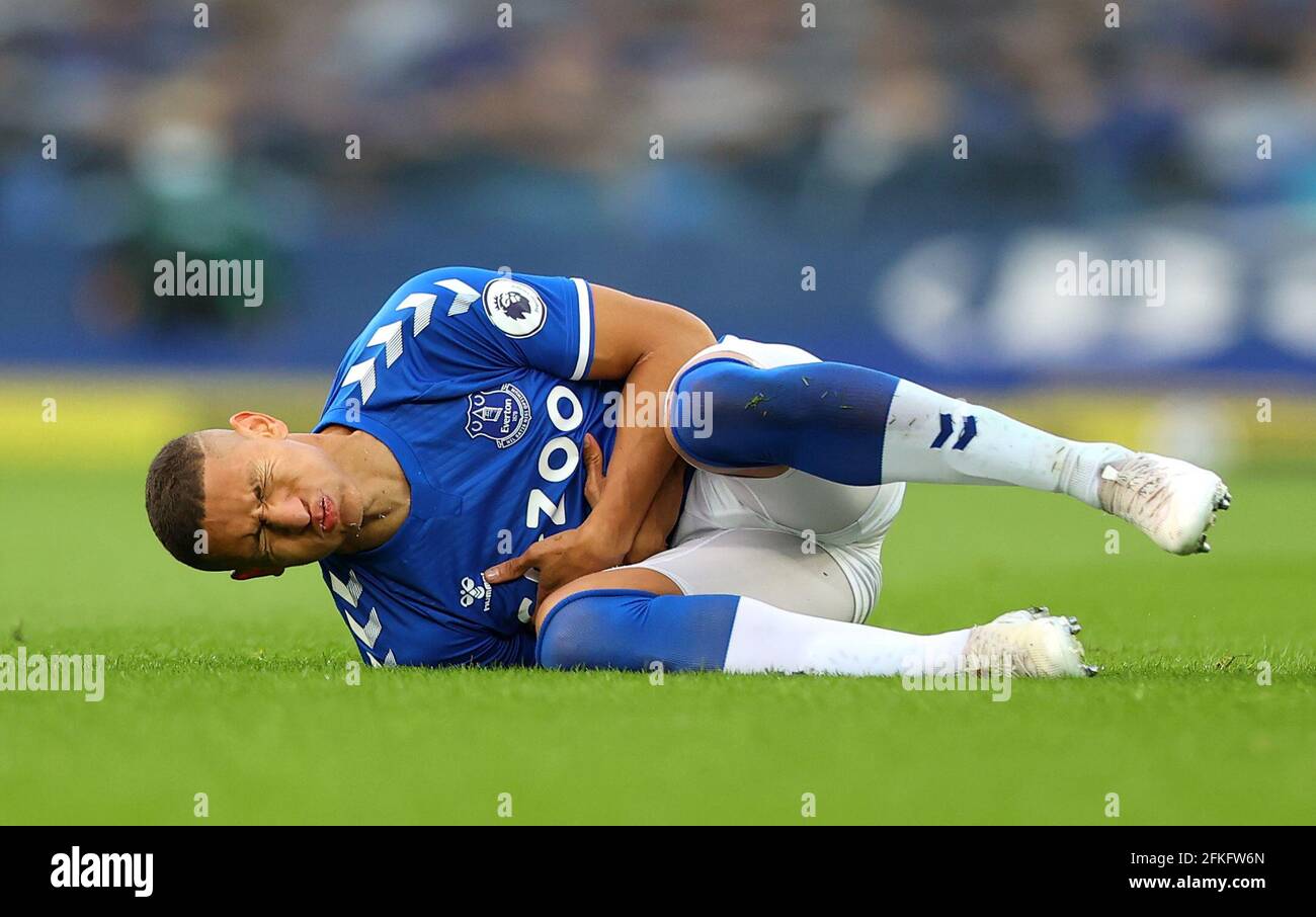 Everton's Richarlison reacts after a collission with Aston Villa's Matty Cash during the Premier League match at Goodison Park, Liverpool. Issue date: Saturday May 1, 2021. Stock Photo