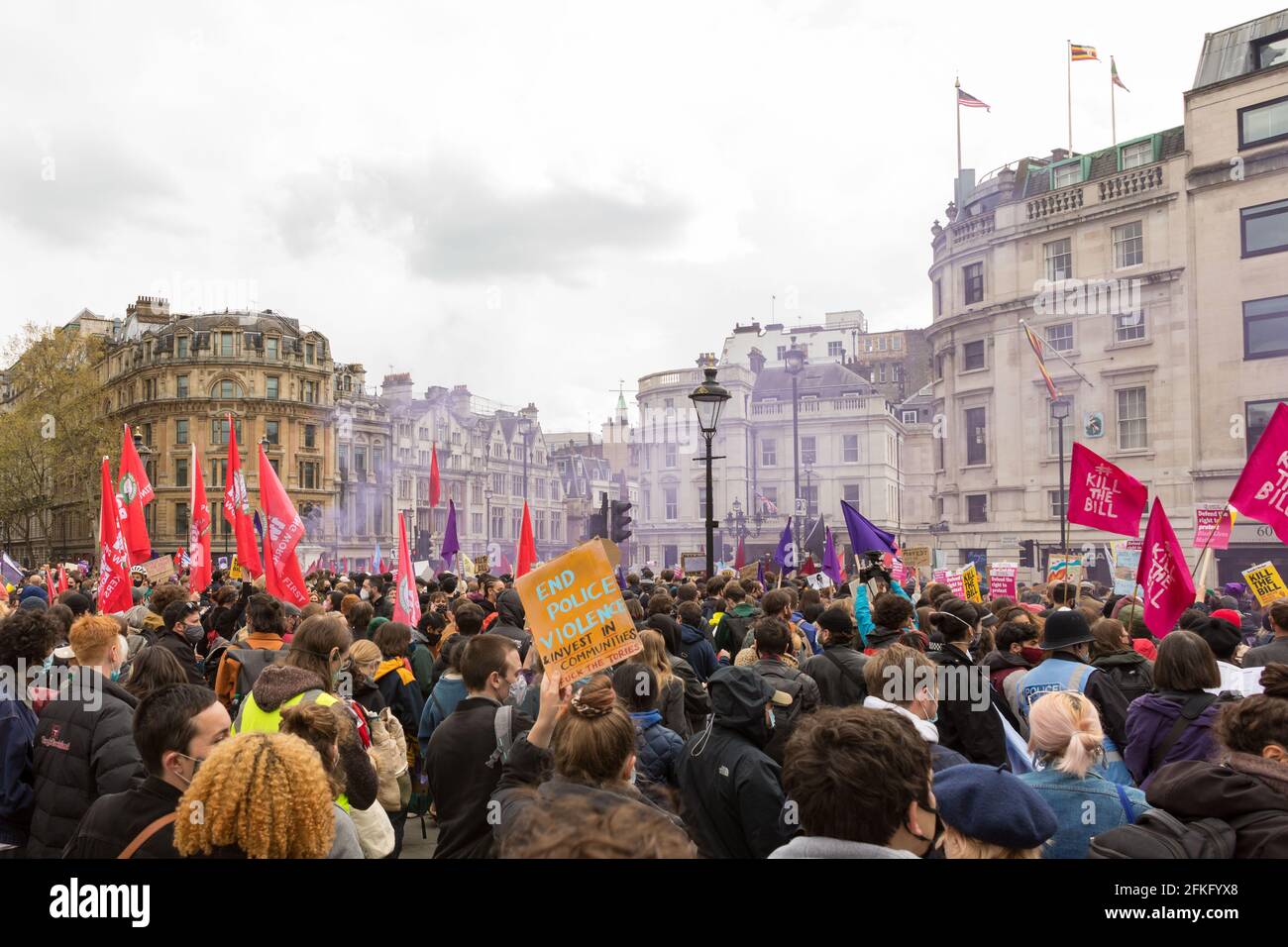 Purple gas is released as the protestors marched from Trafalgar Square, during the Mayday 'Kill the Bill' protests against police brutality and budget, and the Policing and Crime Bill. (Photo by Belinda Jiao / SOPA Images/Sipa USA) Stock Photo
