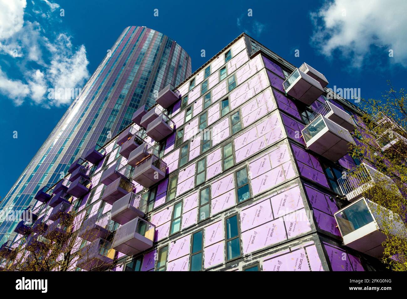 1 May 2021, London, UK - The Stratford Halo development with cladding stripped off, the cladding scandal in the UK emerged in the wake of the Grenfell Tower fire after fire safety regulations have been changed for flammable cladding to be removed Stock Photo