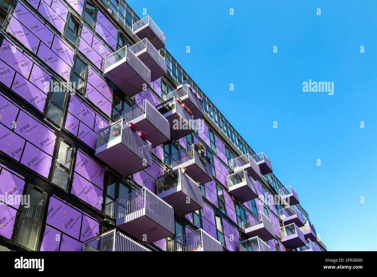 1 May 2021, London, UK - The Stratford Halo development with cladding stripped off, the cladding scandal in the UK emerged in the wake of the Grenfell Tower fire after fire safety regulations have been changed for flammable cladding to be removed Stock Photo
