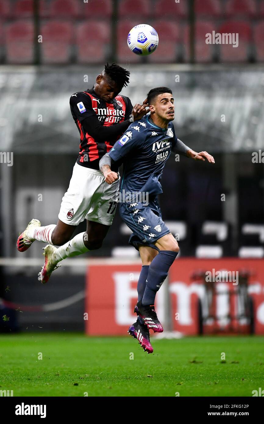 Milan, Italy. 01 May 2021. Rafael Leao (L) of AC Milan competes for a header with Fabio Depaoli of Benevento Calcio during the Serie A football match between AC Milan and Benevento Calcio. Credit: Nicolò Campo/Alamy Live News Stock Photo