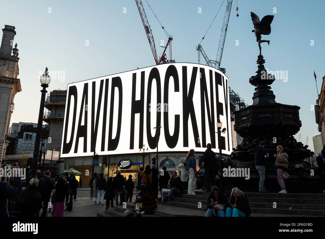 London, UK.  1 May 2021.  Introduction of the artist ahead of David Hockney’s “Remember You Cannot Look At The Sun Or Death For Very Long” artwork, showing an animated sunrise, displayed on the giant screens at Piccadilly Circus.  It will also be displayed on screens in other cities.  The work, created on an iPad, is supposed to offer a symbol of hope as the world awakens from its long lockdown and also coincides with his upcoming “The Arrival of Spring” exhibition at the Royal Academy.  In London, the work is on display nightly for the month of May.  Credit: Stephen Chung / Alamy Live News Stock Photo