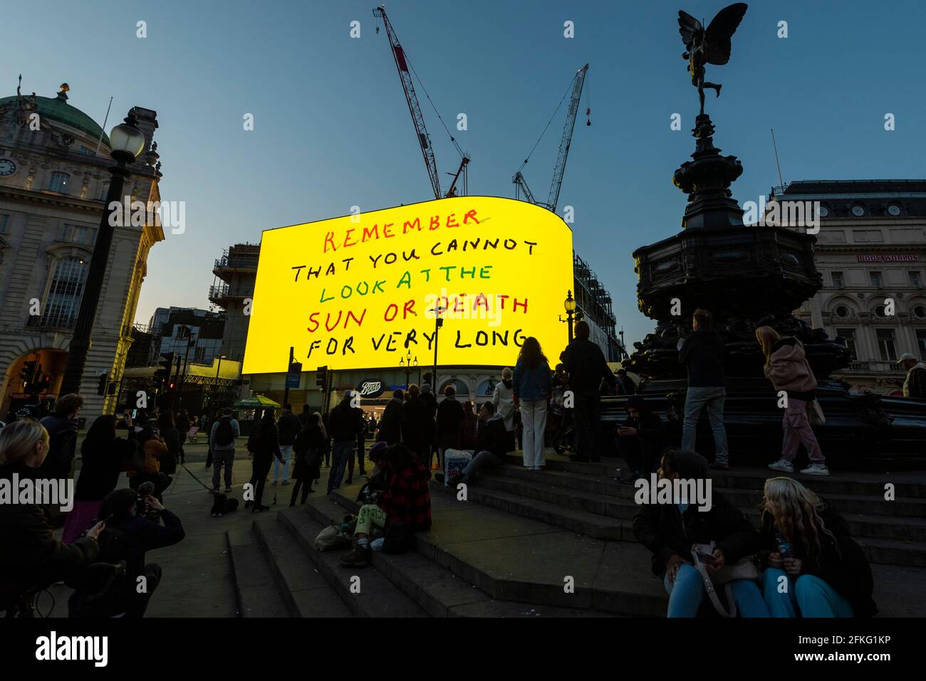 London, UK.  1 May 2021.  David Hockney’s “Remember You Cannot Look At The Sun Or Death For Very Long” artwork, showing an animated sunrise, is displayed on the giant screens at Piccadilly Circus.  It will also be displayed on screens in other cities worldwide.  The work, created on an iPad, is supposed to offer a symbol of hope as the world awakens from its long lockdown and also coincides with his upcoming “The Arrival of Spring” exhibition at the Royal Academy.  In London, the work is on display nightly for the month of May.  Credit: Stephen Chung / Alamy Live News Stock Photo