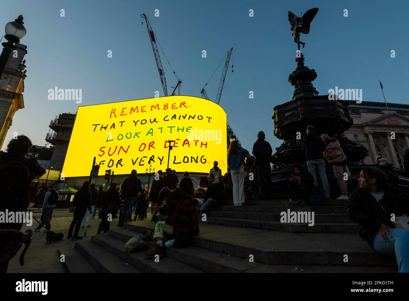 London, UK.  1 May 2021.  David Hockney’s “Remember You Cannot Look At The Sun Or Death For Very Long” artwork, showing an animated sunrise, is displayed on the giant screens at Piccadilly Circus.  It will also be displayed on screens in other cities worldwide.  The work, created on an iPad, is supposed to offer a symbol of hope as the world awakens from its long lockdown and also coincides with his upcoming “The Arrival of Spring” exhibition at the Royal Academy.  In London, the work is on display nightly for the month of May.  Credit: Stephen Chung / Alamy Live News Stock Photo
