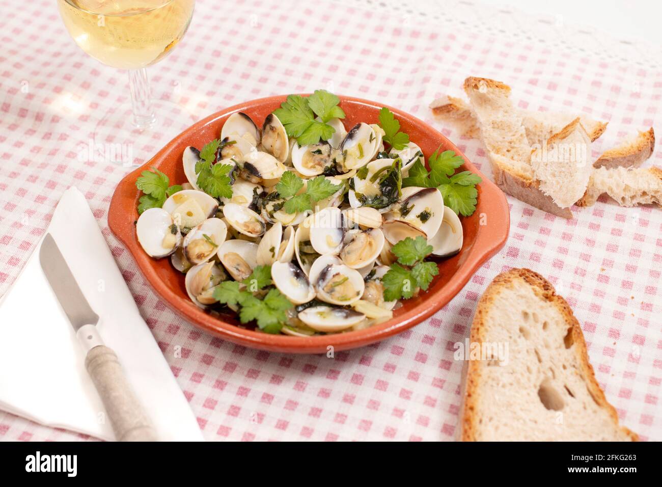 Typical starter portuguese meal of clams with garlic, olive oil and