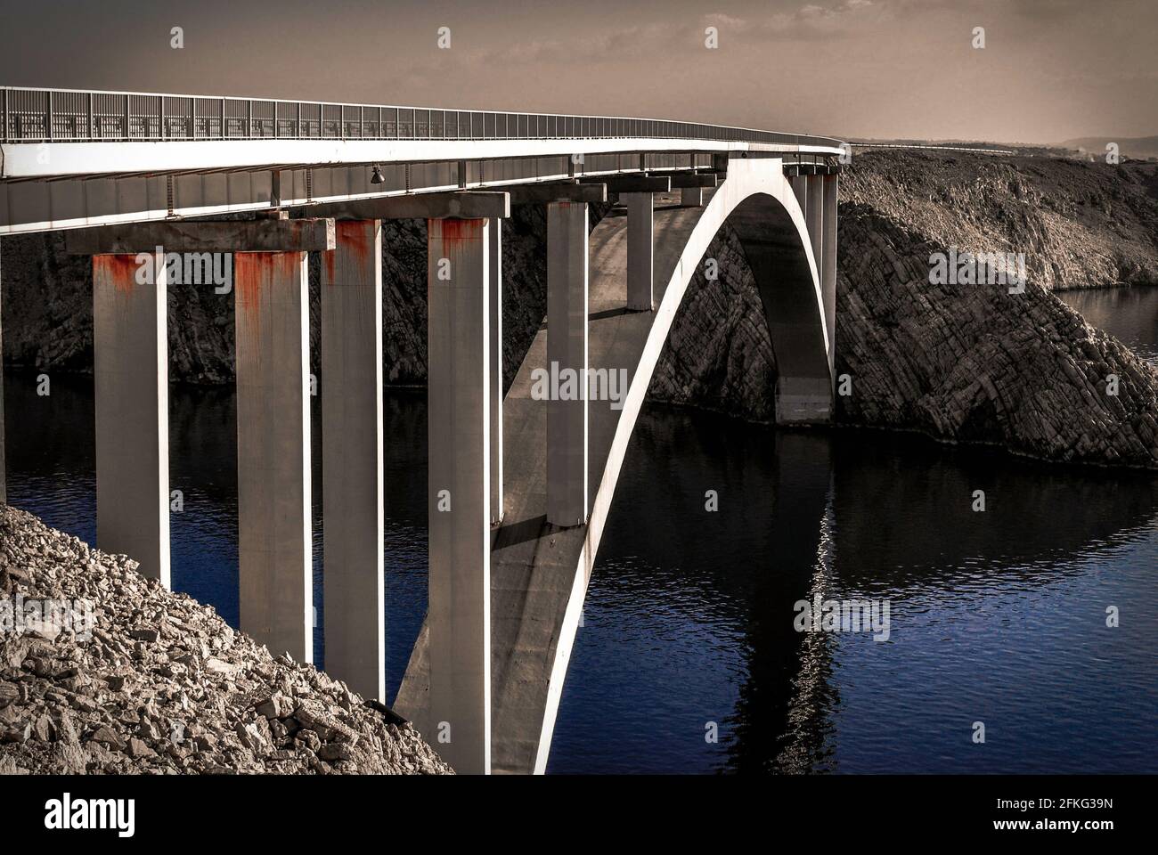 Closeup of an arch bridge over a river Stock Photo - Alamy