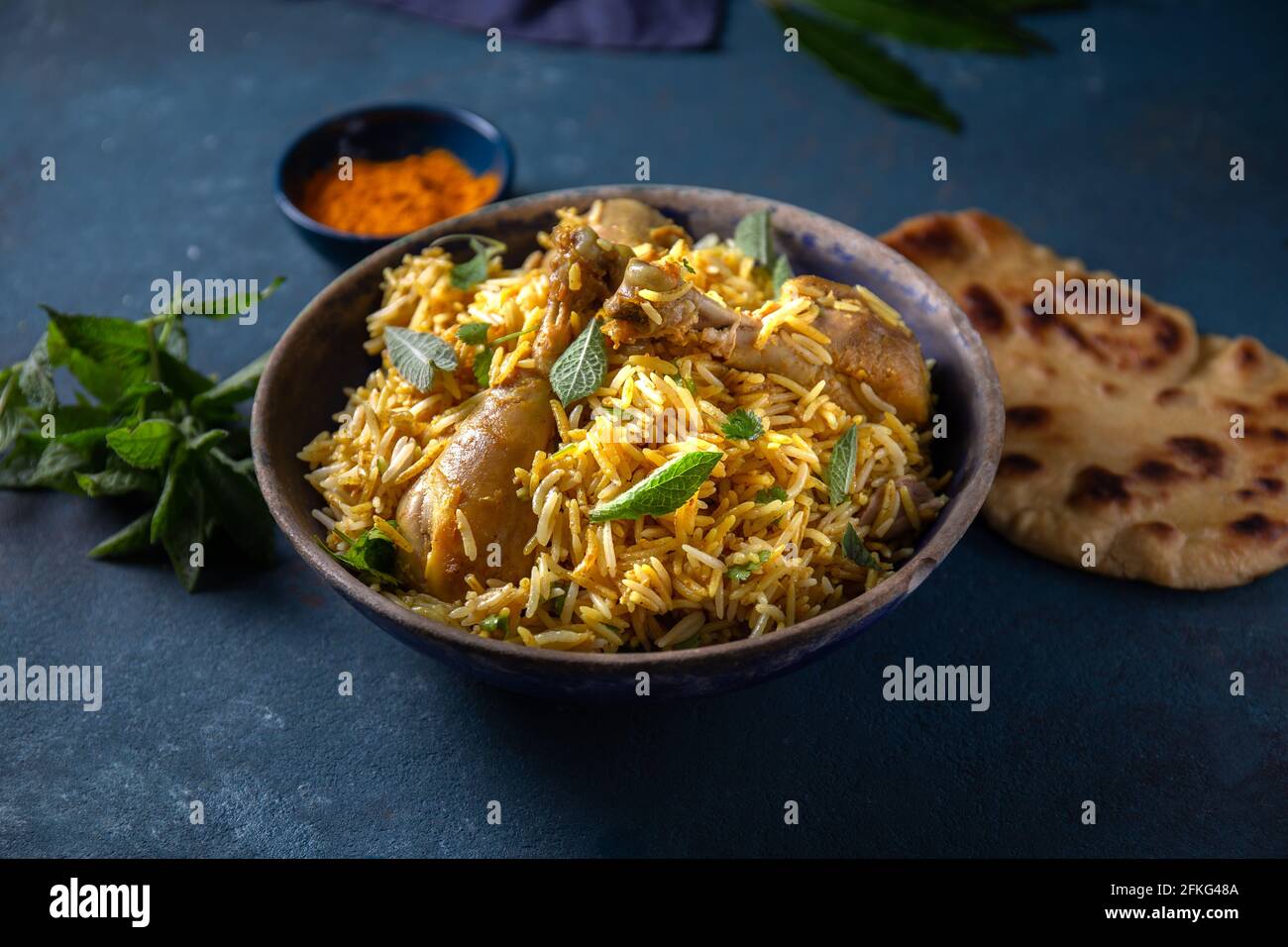 Pakistani and Indian chicken Biryani rice with mint and naa bread Stock