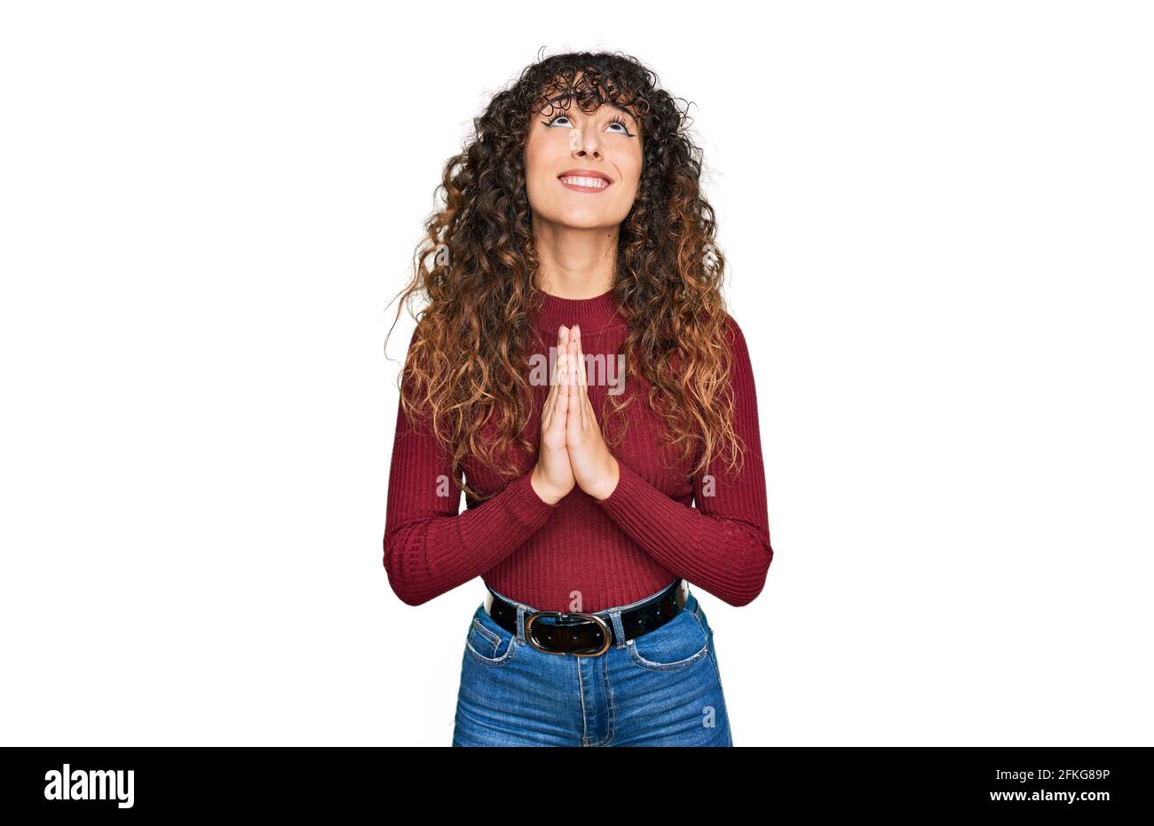 Young hispanic girl wearing casual clothes begging and praying with ...
