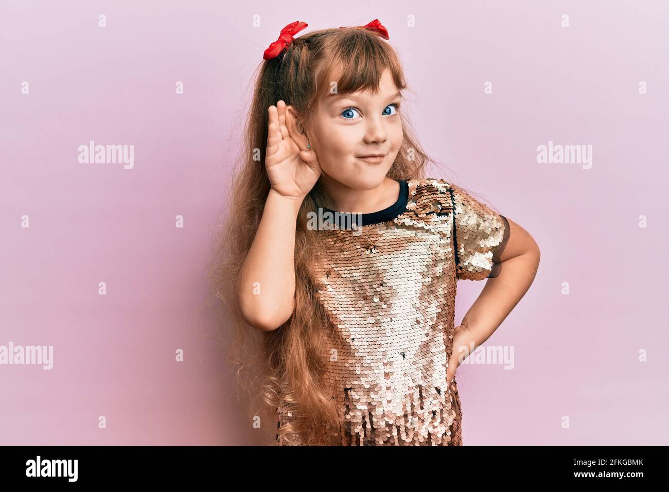 Little caucasian girl kid wearing festive sequins dress smiling with ...