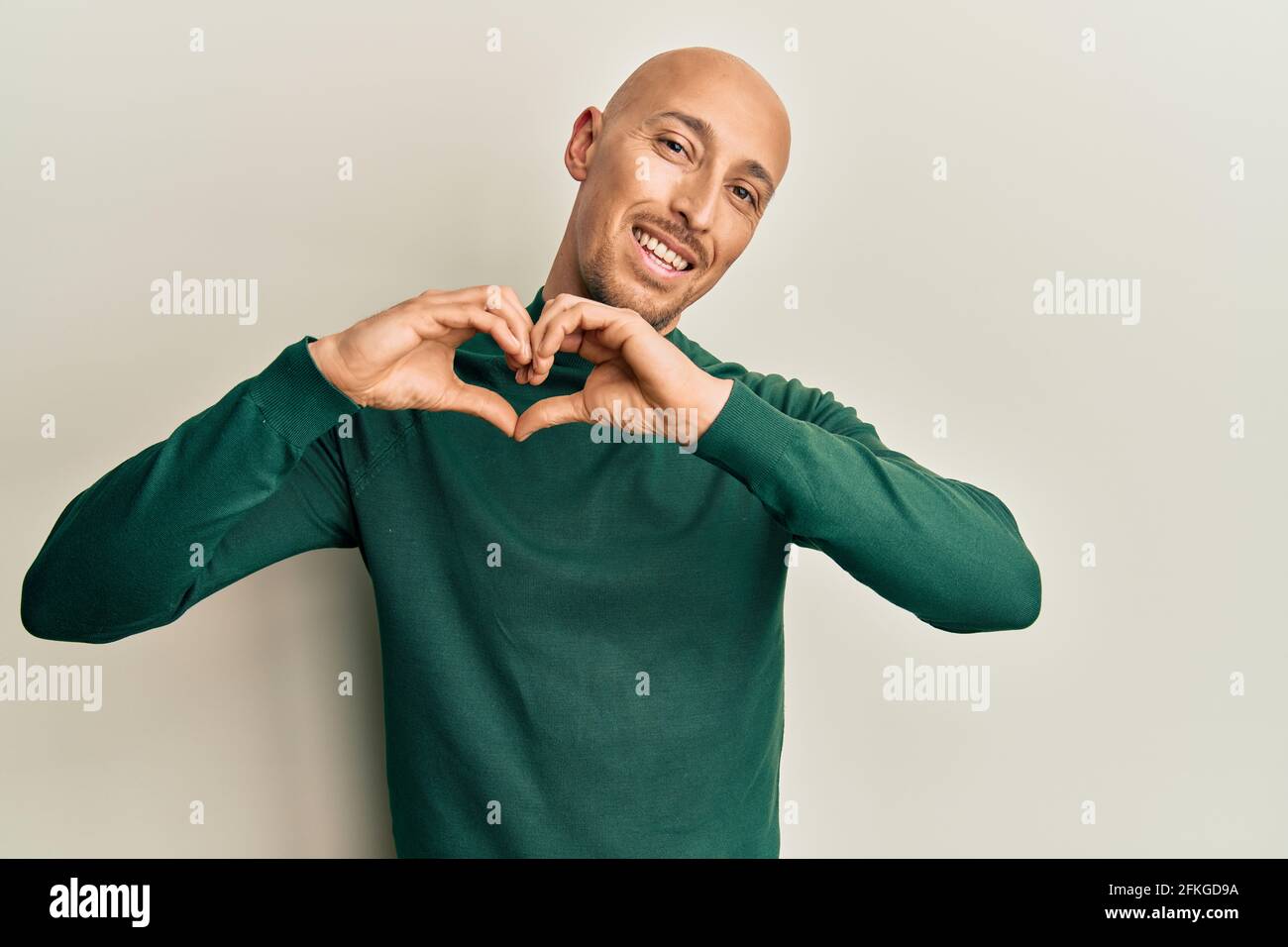 bald man turtleneck