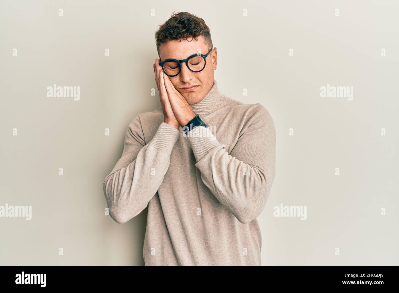 Hispanic Young Man Wearing Casual Turtleneck Sweater Sleeping Tired 