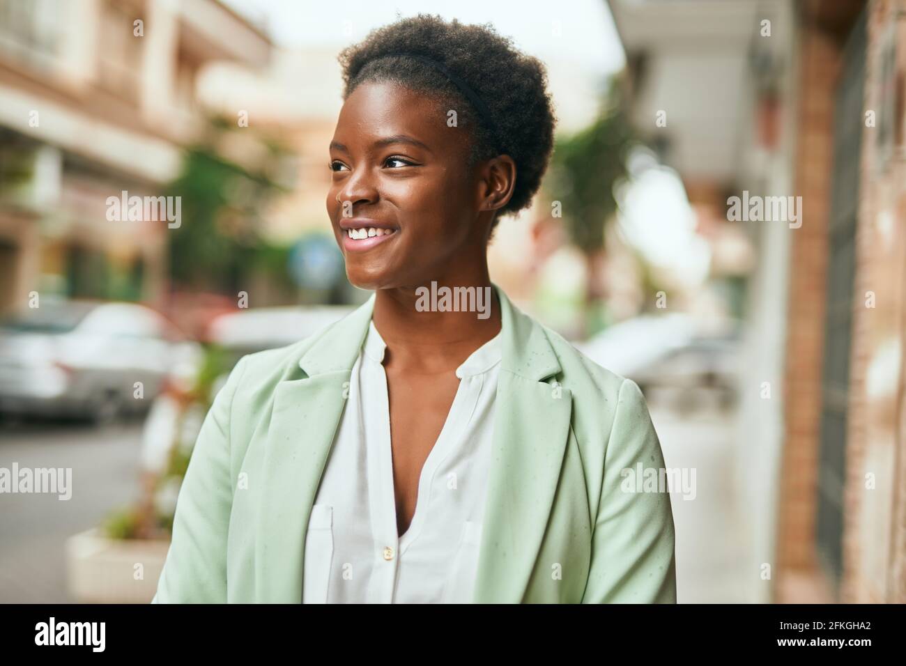 Young african american businesswoman smiling happy standing at the city ...