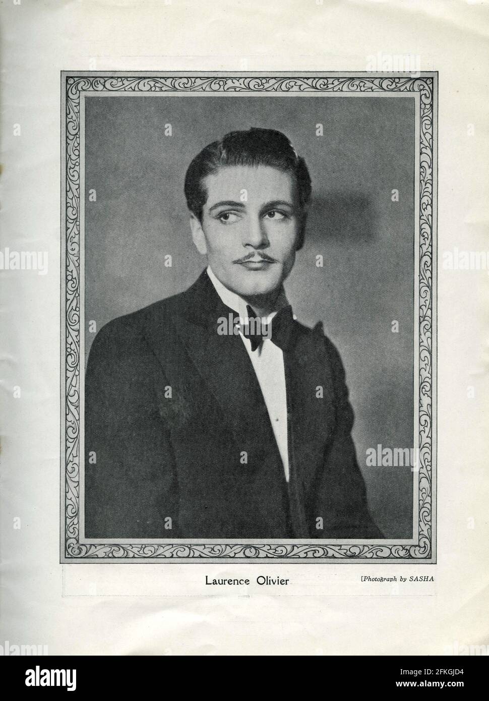 LAURENCE OLIVIER portrait as Victor Prynne by SASHA in PRIVATE LIVES An Intimate Comedy in Three Acts written and produced by Noel Coward presented by Charles B. Cochran at the Phoenix Theatre in London from 24th September 1930 Stock Photo