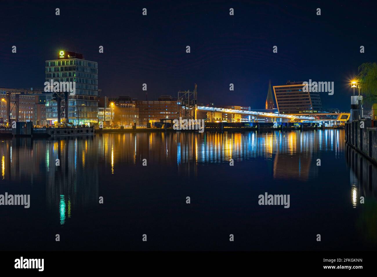 Closeup shot of city buildings reflected in the water at night Stock ...