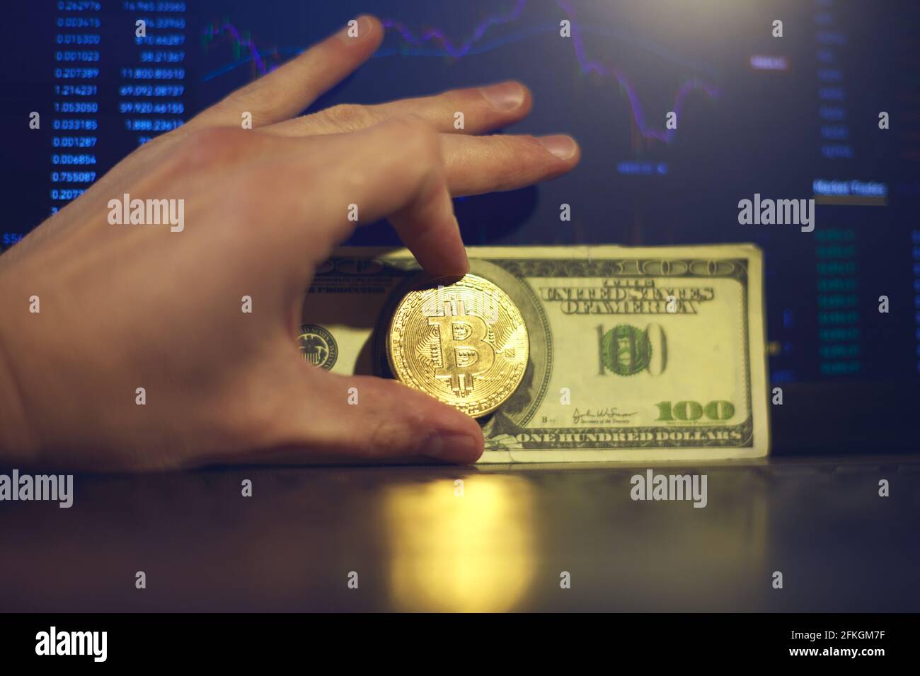 Two gold bitcoin coins, one standing up and one laying down with a black  background Stock Photo - Alamy