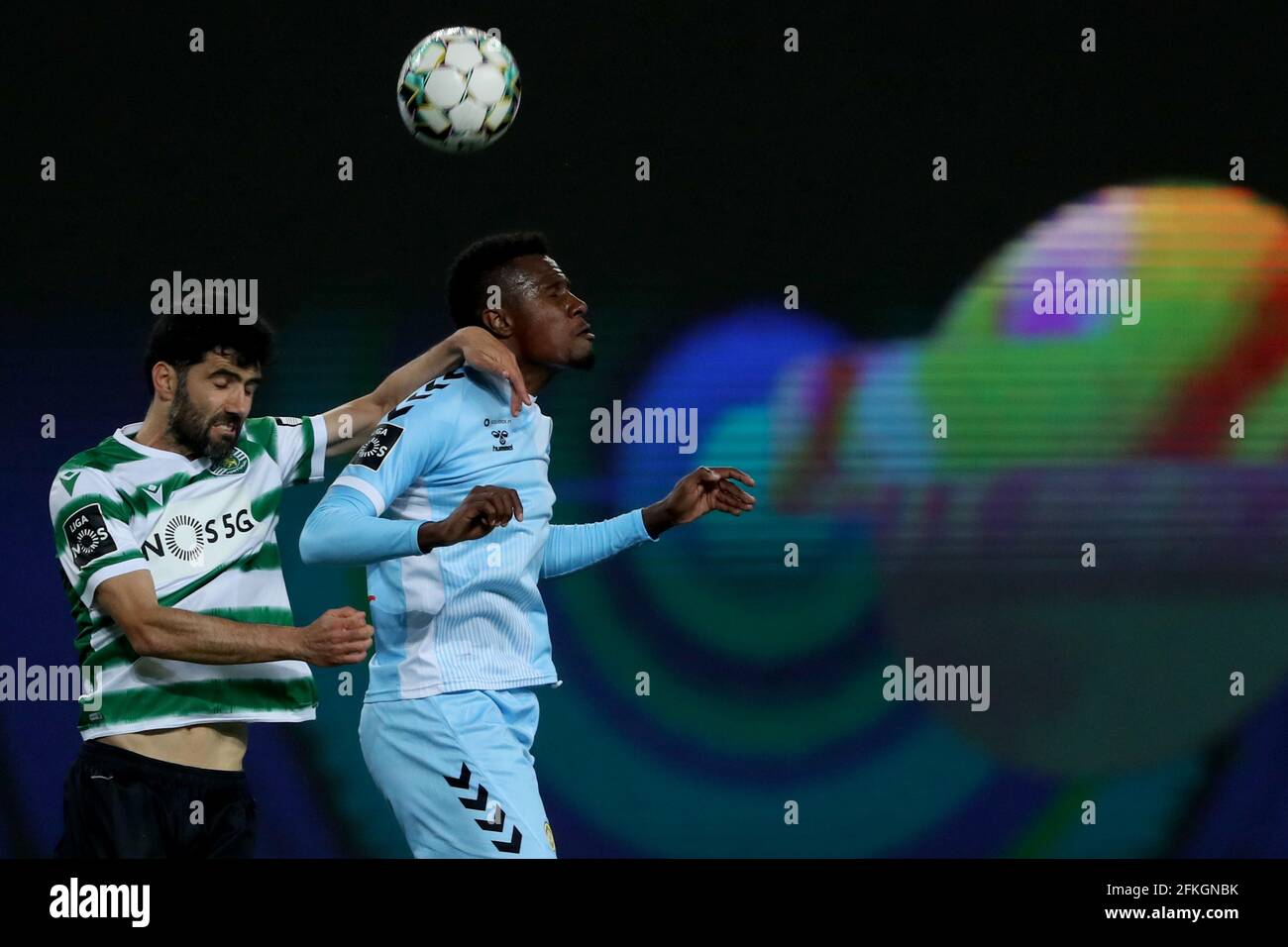Lisbon, Portugal. 1st May, 2021. Luis Neto of Sporting CP (L) vies with Pedrao of CD Nacional during the Portuguese League football match between Sporting CP and CD Nacional at Jose Alvalade stadium in Lisbon, Portugal on May 1, 2021. Credit: Pedro Fiuza/ZUMA Wire/Alamy Live News Stock Photo