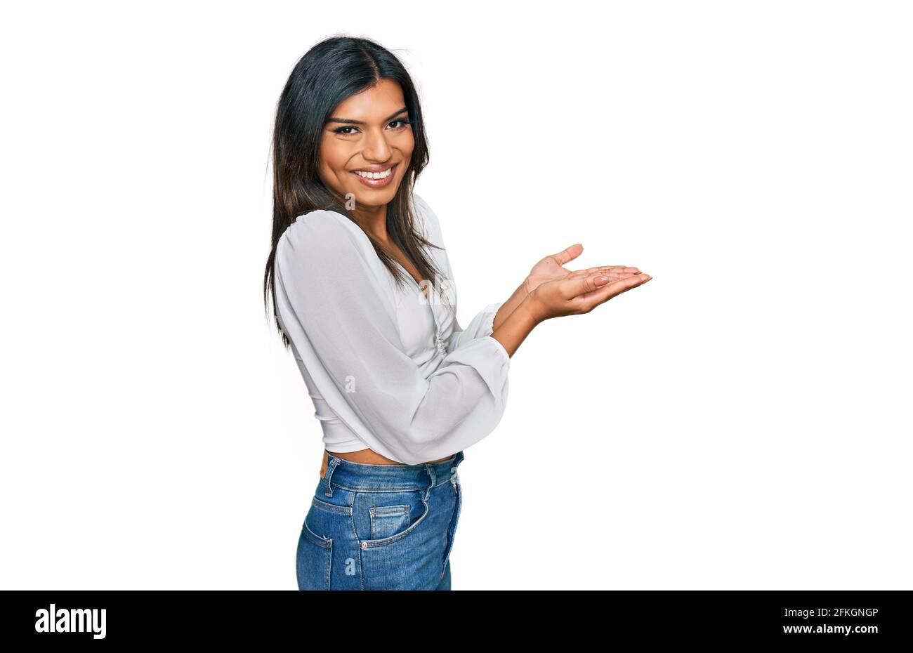 Young latin transsexual transgender woman wearing casual clothes pointing  aside with hands open palms showing copy space, presenting advertisement  smi Stock Photo - Alamy
