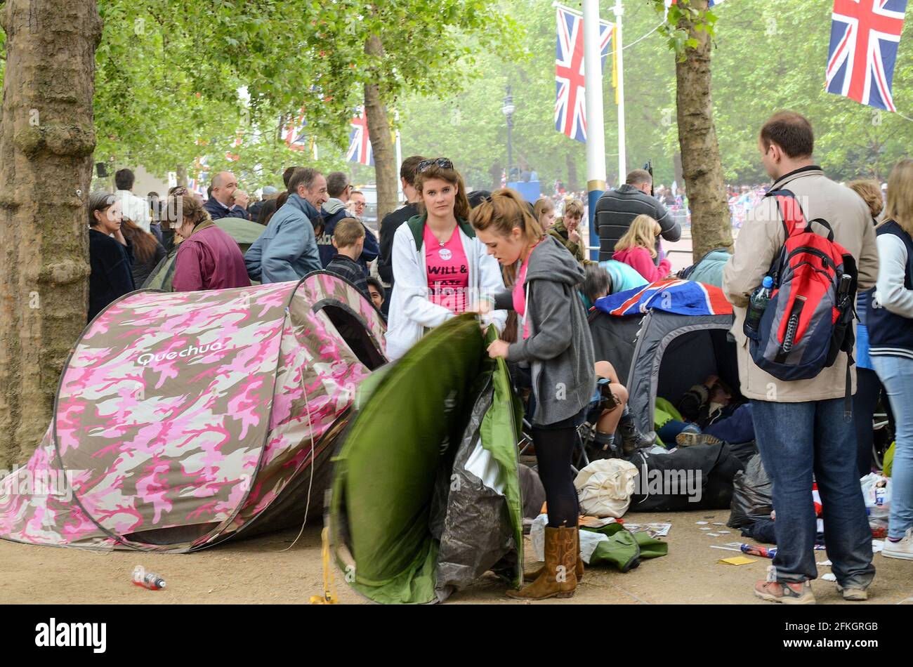 2011 Royal wedding. People have camped in tents in The Mall to be first on the fence hoping to catch a glimpse of William and Kate. Packing away Stock Photo