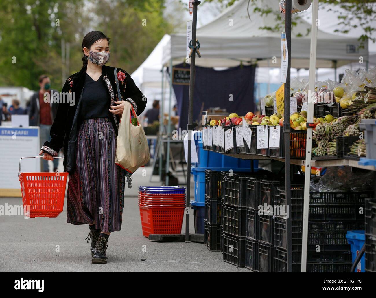 Vancouver, Canada. 1st May, 2021. A woman visits a summer Vancouver farmers market in Vancouver, British Columbia, Canada, on May 1, 2021. The 2021 summer Vancouver Farmers Markets kicked off on Saturday and will run till October in several locations across the city. Credit: Liang Sen/Xinhua/Alamy Live News Stock Photo