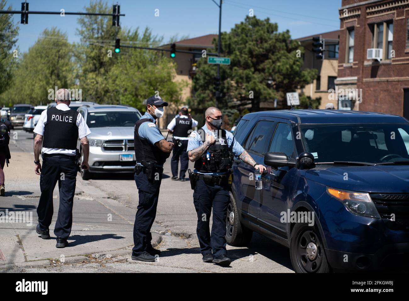 USA. 01st May, 2021. Chicago police officers stand watch ahead of a march  for 22-year-old Anthony Alvarez on May 1, 2021 in Chicago, IL. Chicago  Police body cam footage shows that Anthony
