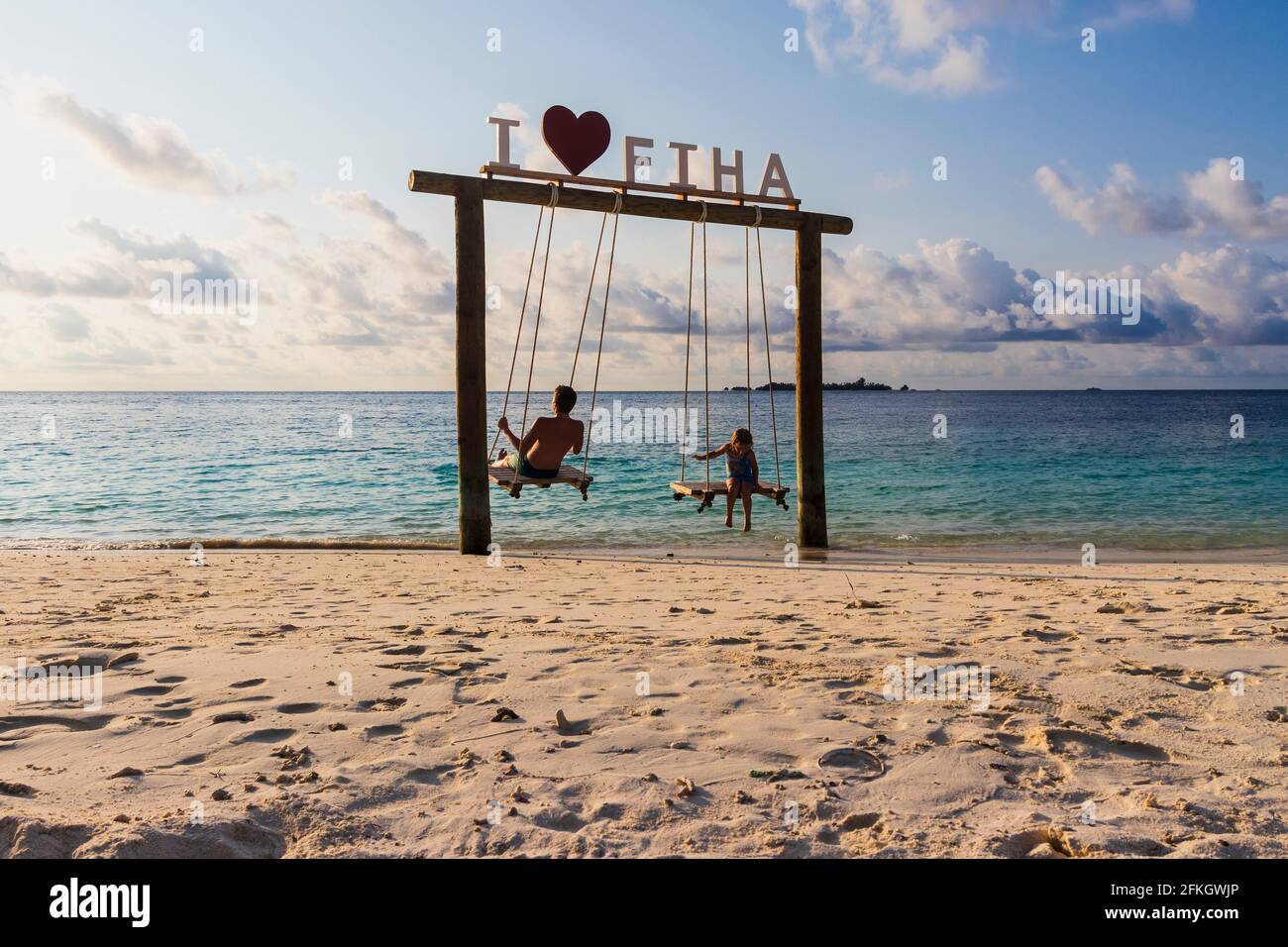 Male, Maldives 04.24.2021 - Kids are playing on the swing at Fihalhohi  island resort beach Stock Photo - Alamy