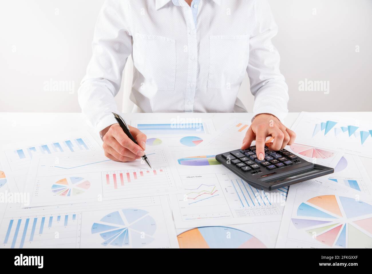 Business woman pointing at graph document close-up. Young business ...