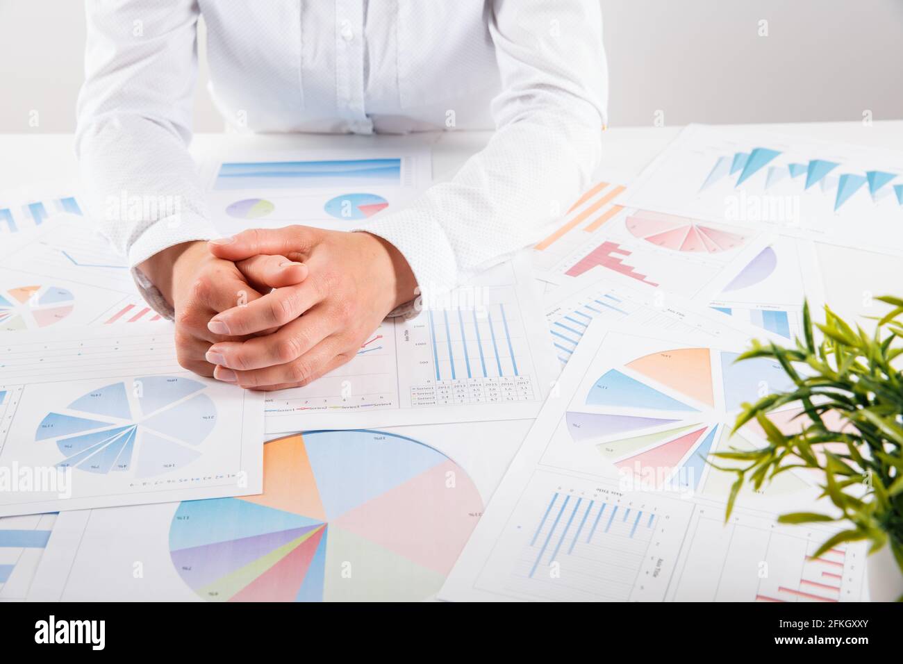 Business woman pointing at graph document close-up. Young business ...