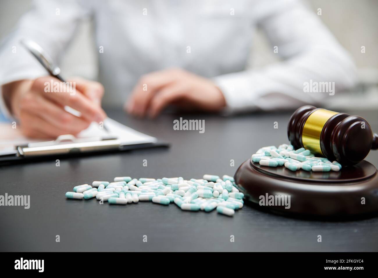 Medicine law concept. Judges gavel with pills close up Stock Photo