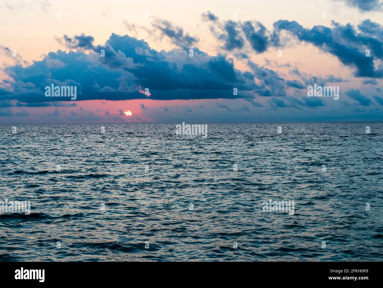 Dramatic sunset over the sea Stock Photo - Alamy