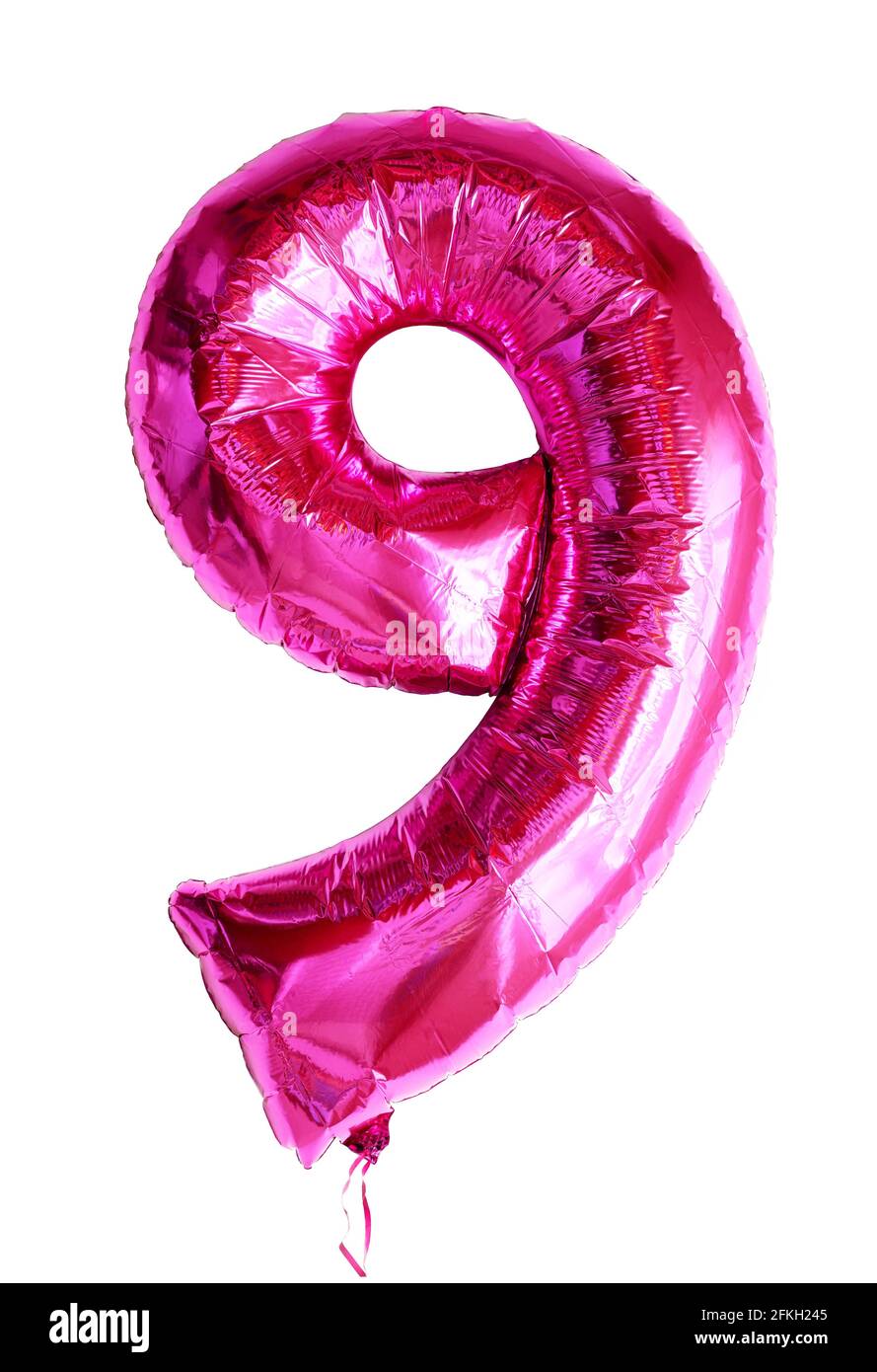 Foil balloon number 9 isolated on white background, pink numeral Nine made as inflatable balloon number for party. Shiny metallic flying figure 9 for Stock Photo