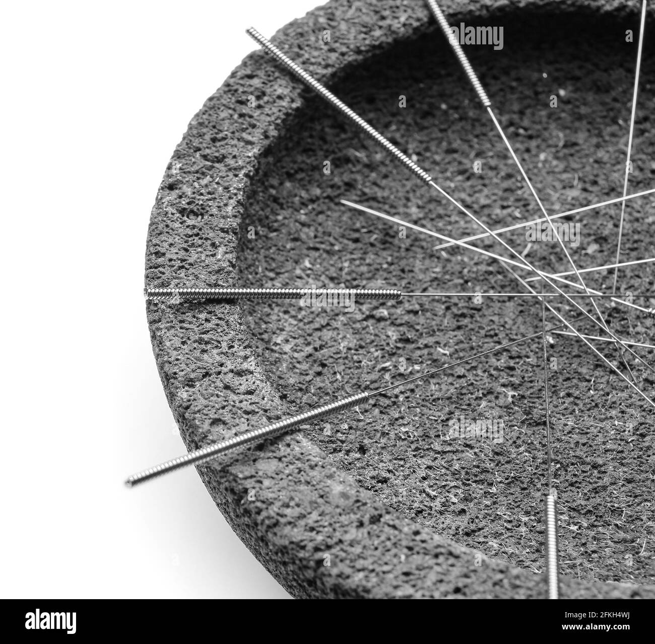 Stand with acupuncture needles on white background, closeup Stock Photo