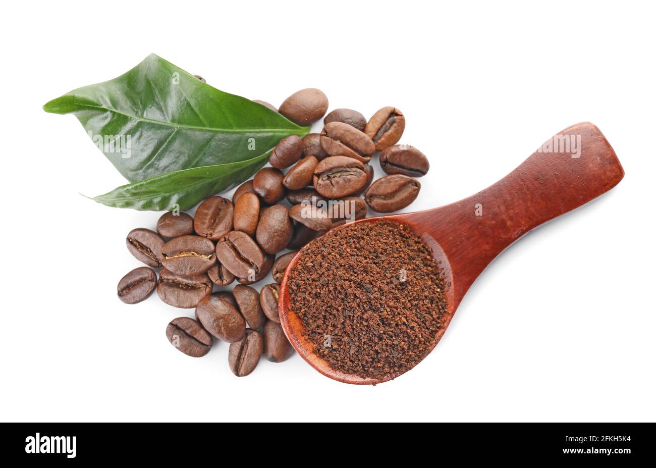 Coffee beans and spoon with powder on white background Stock Photo - Alamy