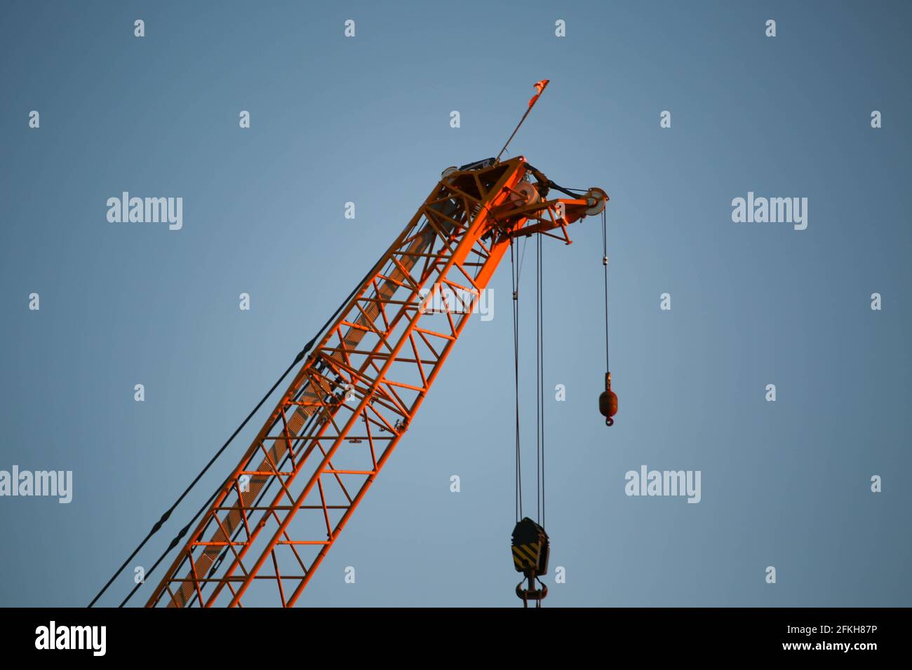 Washington, D.C., USA. 1st May, 2021. A crane stands over the newly upgraded 11th Street Bridge in the Navy Yard neighborhood along the Anacostia River at sunset. Credit: Bryan Dozier/Alamy Live News Stock Photo