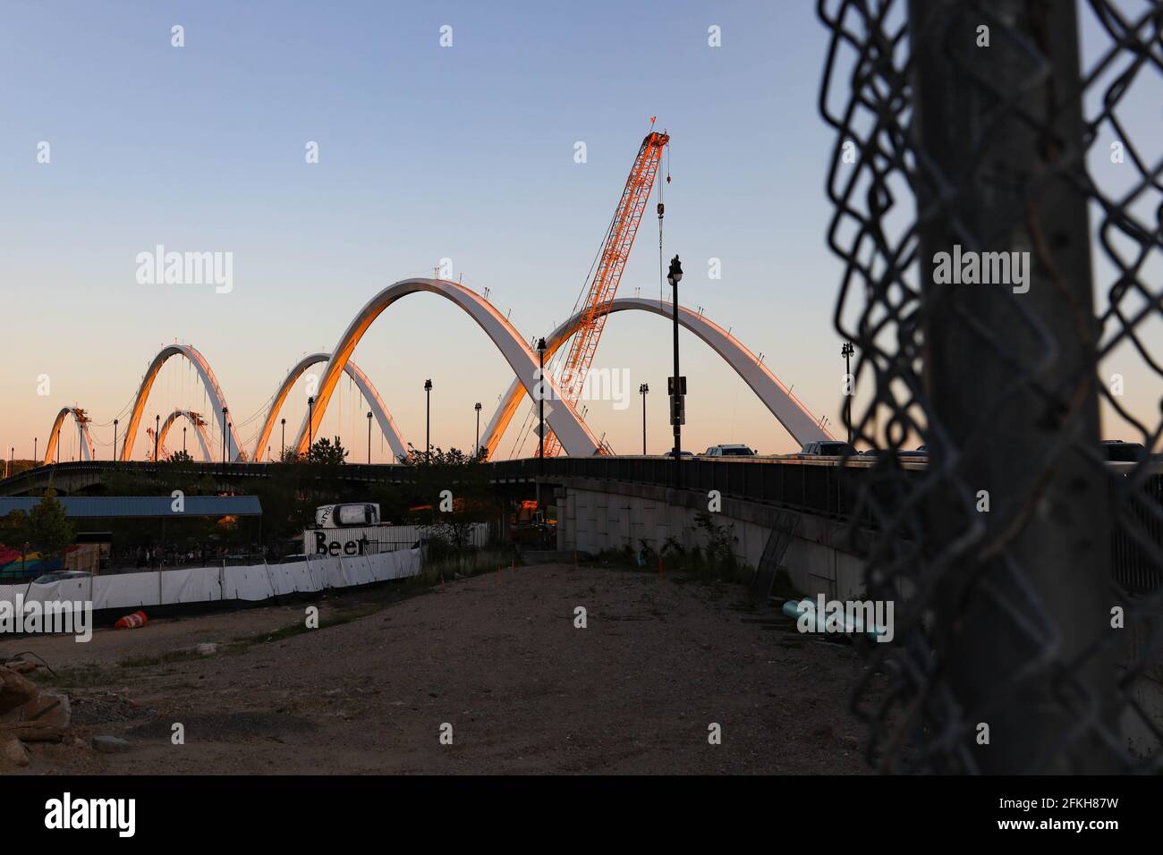 Washington, D.C., USA. 1st May, 2021. A newly upgraded 11th Street Bridge is seen at sunset in the Navy Yard neighborhood along the Anacostia River. Credit: Bryan Dozier/Alamy Live News Stock Photo