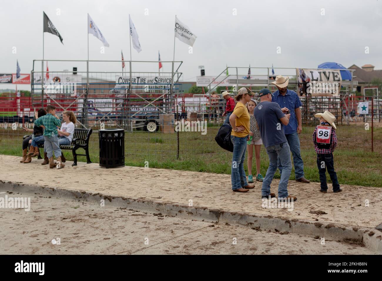 Roanoke, Texas, USA. 1st May, 2021. 5/1/21 Roanoke, Texas - A rodeo pin stands empty after a junior rodeo took place. The road and side walk is covered with mud after the rodeo ended. This is one of the first public fairs that have taken place since Texas has opened up 100% since the COVID-19 pandemic hit the state. Credit: Chris Rusanowsky/ZUMA Wire/Alamy Live News Stock Photo