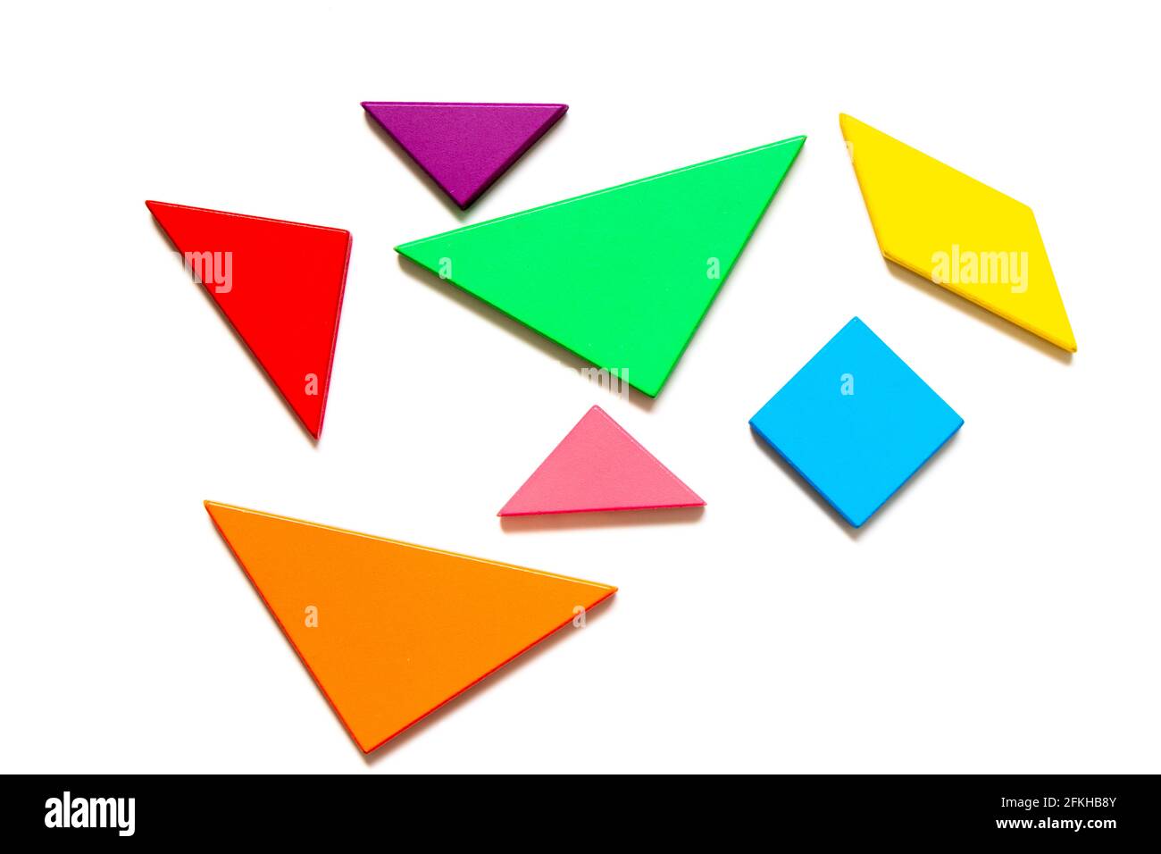 Color wood tangram puzzle in geometric shape wait to build on white ...
