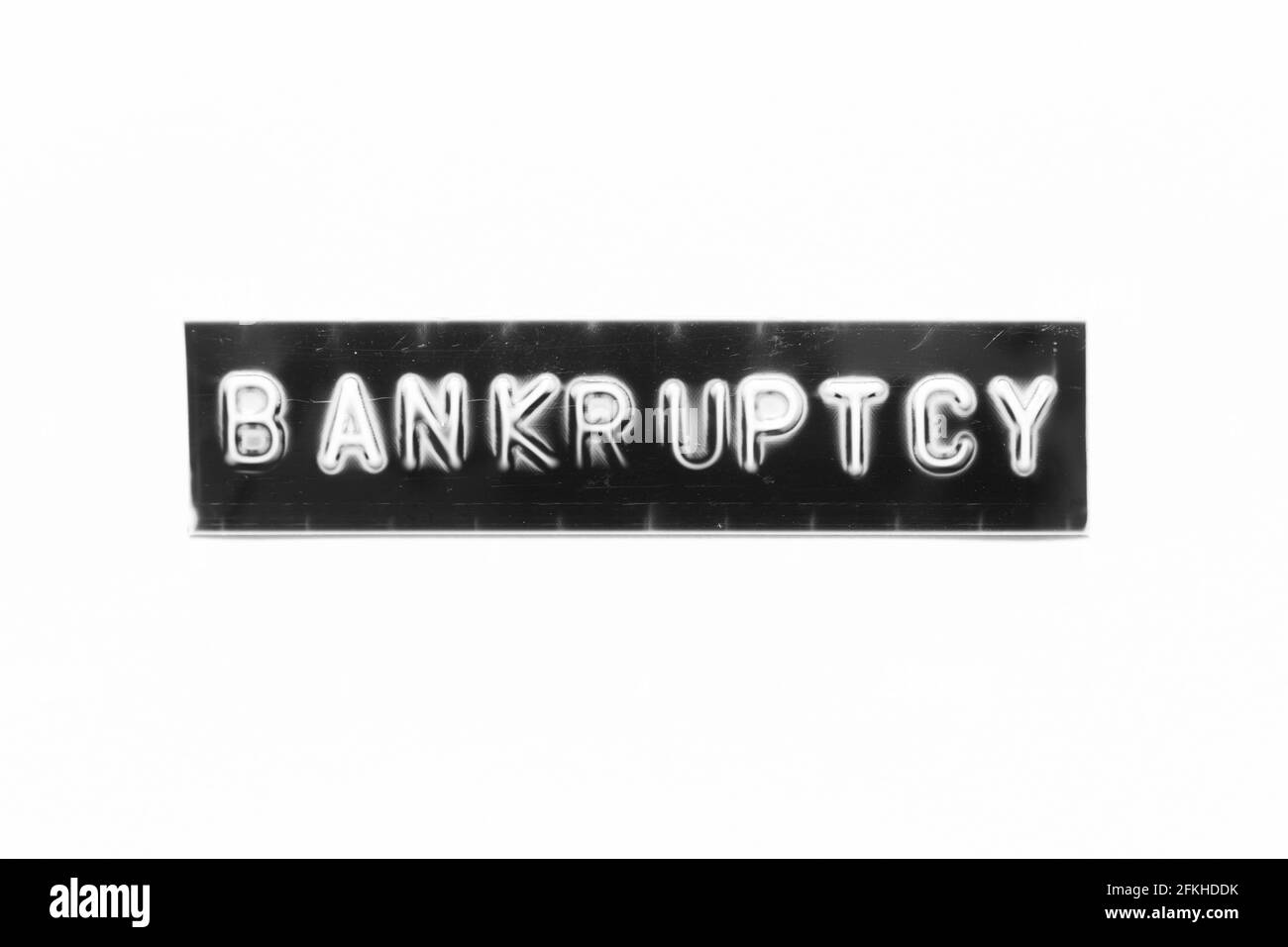 Embossed letter with word bankruptcy in black banner on white paper background Stock Photo