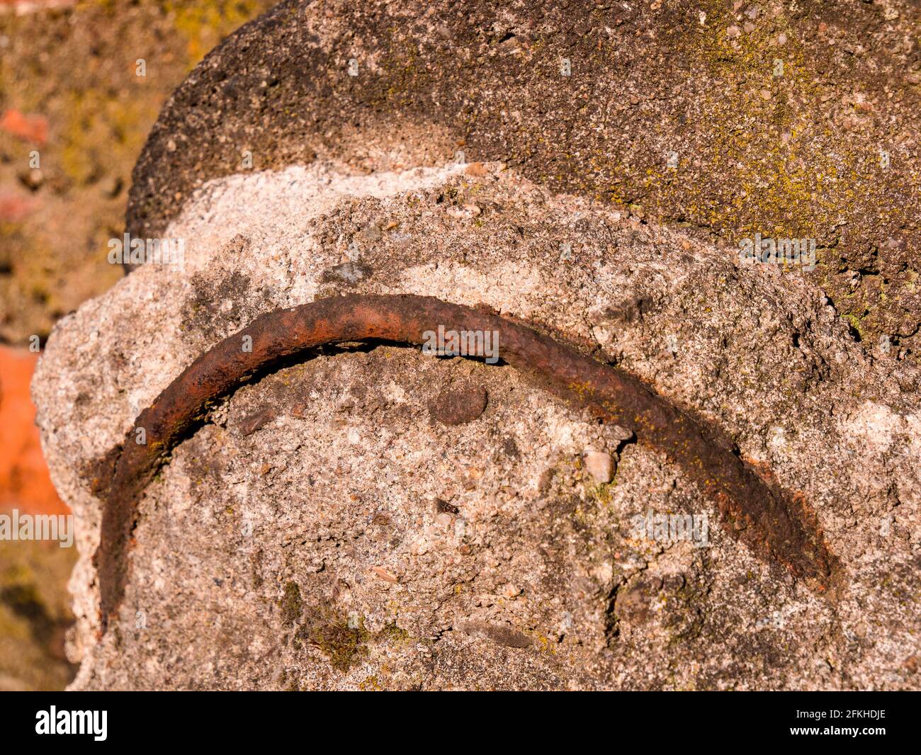 Old rusty iron reinforcement in concrete Stock Photo