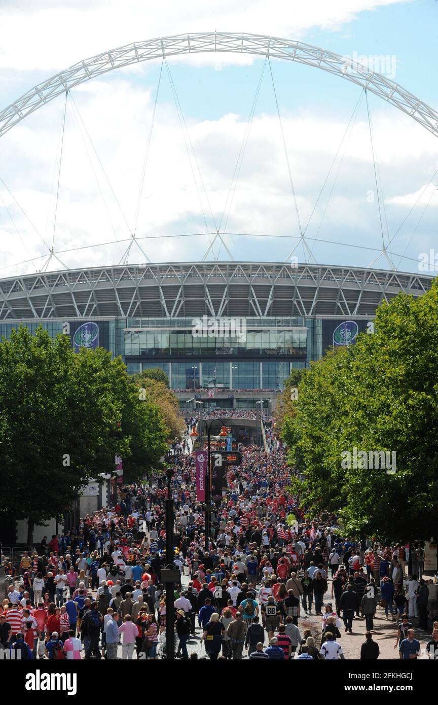 File photo dated 27/8/2011 of fans making their way along Wembley Way before the Carnegie Challenge Cup Final at Wembley Stadium, London. Wembley Park, London's globally renowned entertainment district, has undergone significant change over the past 70 years, with the newly built Olympic Steps signifying the final piece of the puzzle in the development of the iconic Olympic Way, also known as 'Wembley Way'. Issue date: Sunday May 2, 2021. Stock Photo