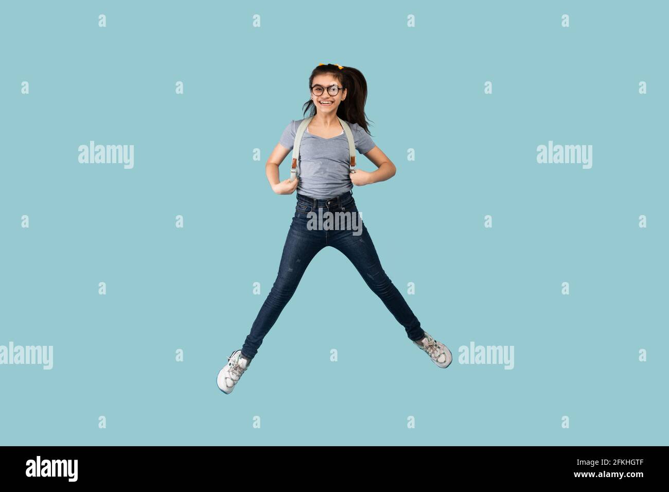 Latin teen girl jumping on hi-res stock photography and images - Alamy