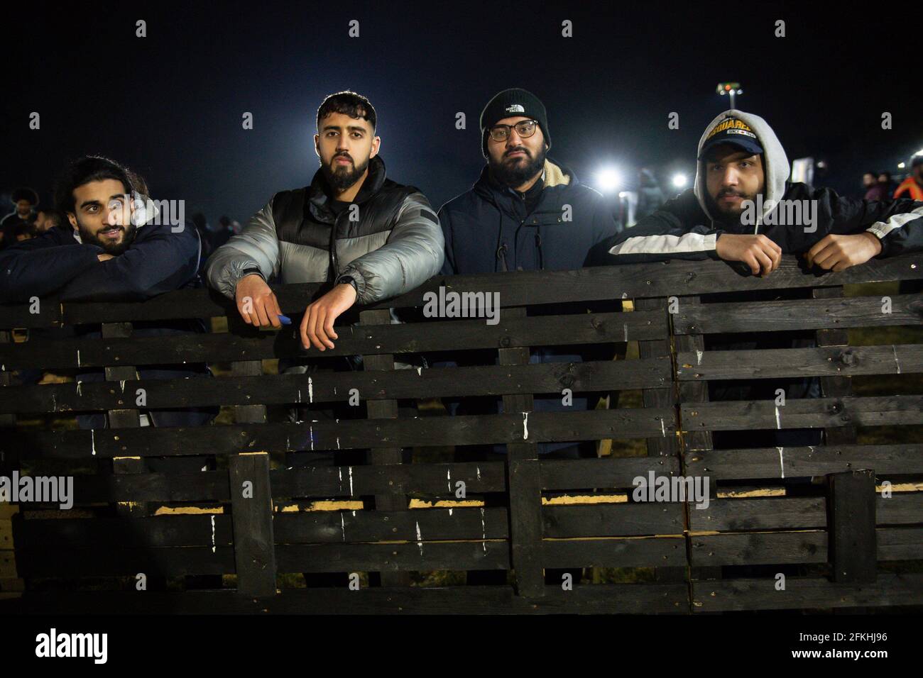 Spectators at the Midnight Ramadan League. In it's fourth year, the league is being played outdoors for the first time to due to Covid-19 restrictions, and allows Muslims in Birmingham to continue playing football every weekend during the holy month after their daily fast. Picture date: Saturday May 1, 2021. Stock Photo