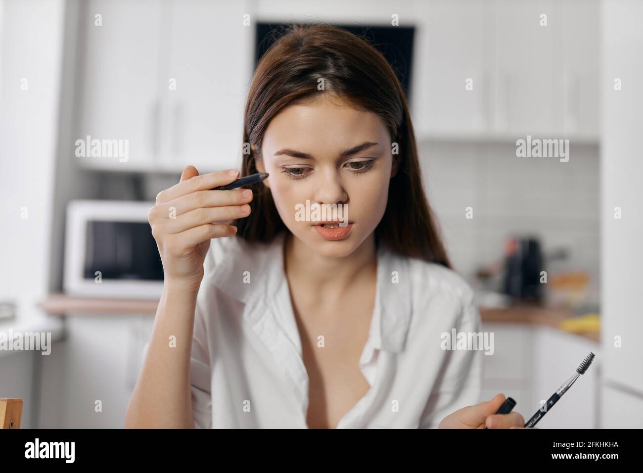 Beautiful woman eyeliner pencil hi-res stock photography and images - Alamy