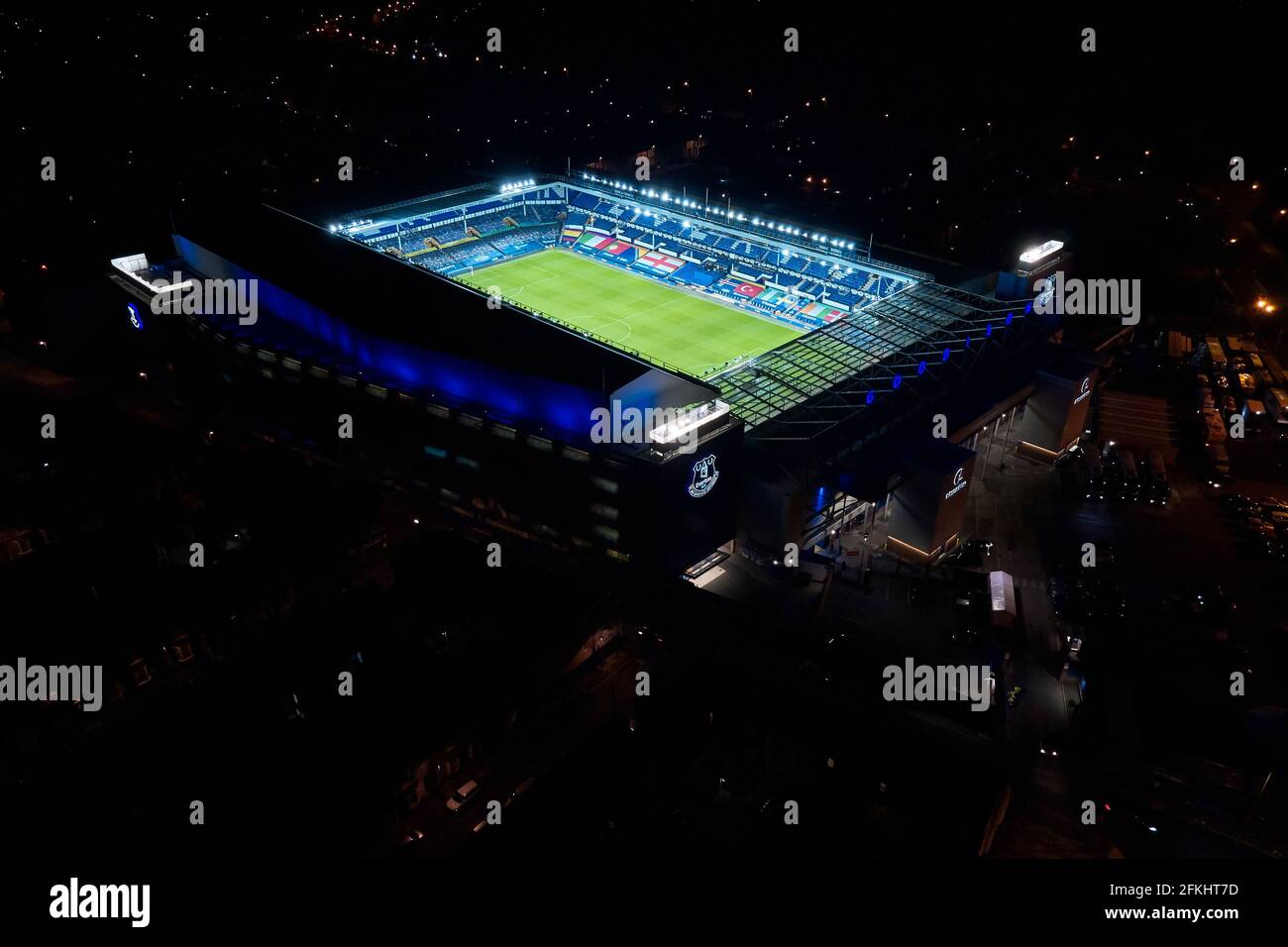 A general view of Goodison Park at night with the floodlights on after a football match showing the stadium in it’s urban setting Stock Photo