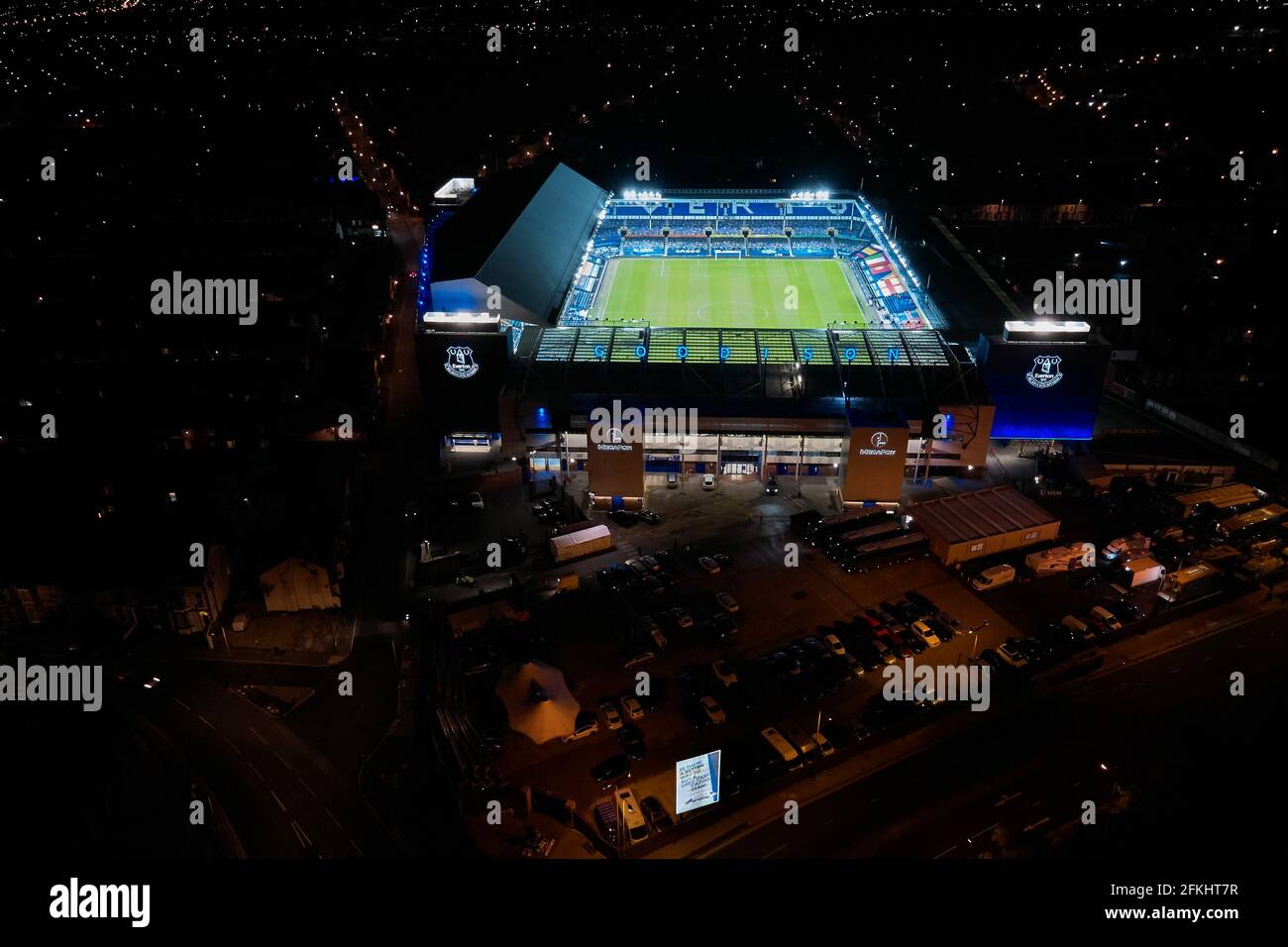 A general view of Goodison Park at night with the floodlights on after a football match showing the stadium in it’s urban setting Stock Photo