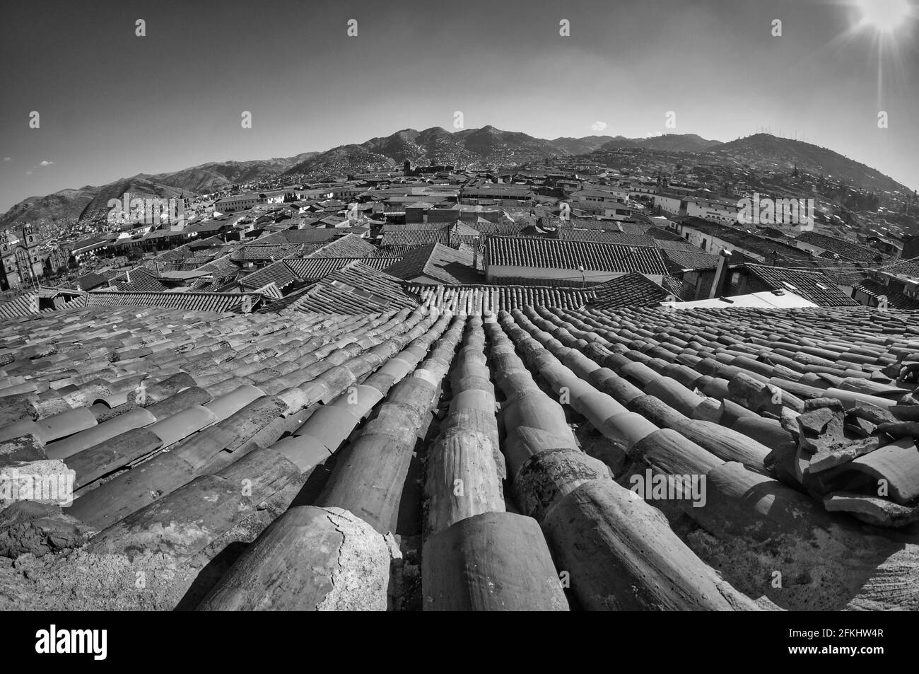 A grayscale of brick roof with a view to city Stock Photo - Alamy