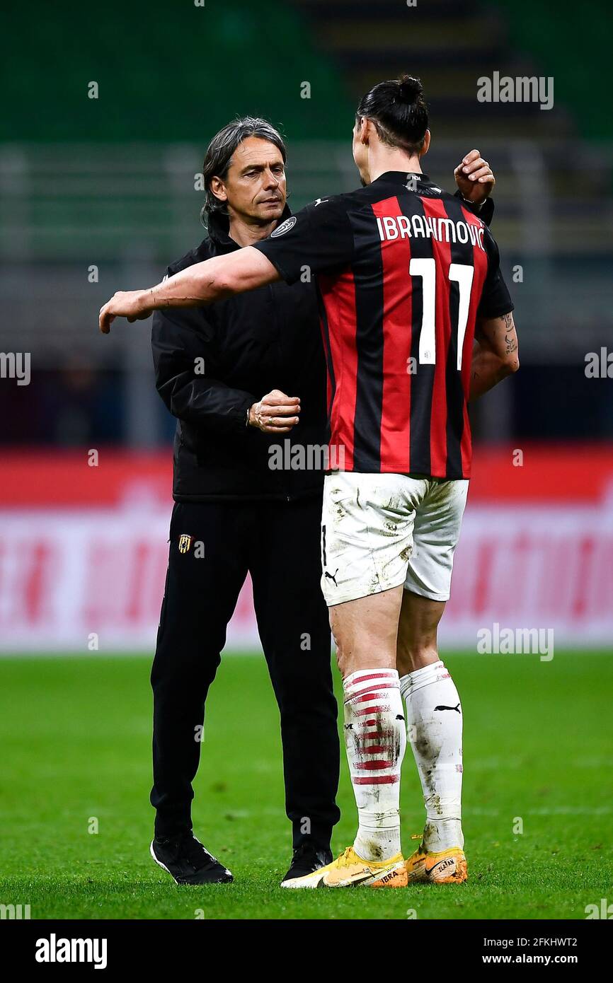 Milan, Italy. 01 May 2021. Filippo Inzaghi (L), head coach of Benevento Calcio, shakes hands with Zlatan Ibrahimovic of AC Milan at the end of the Serie A football match between AC Milan and Benevento Calcio. AC Milan won 2-0 over Benevento Calcio. Credit: Nicolò Campo/Alamy Live News Stock Photo