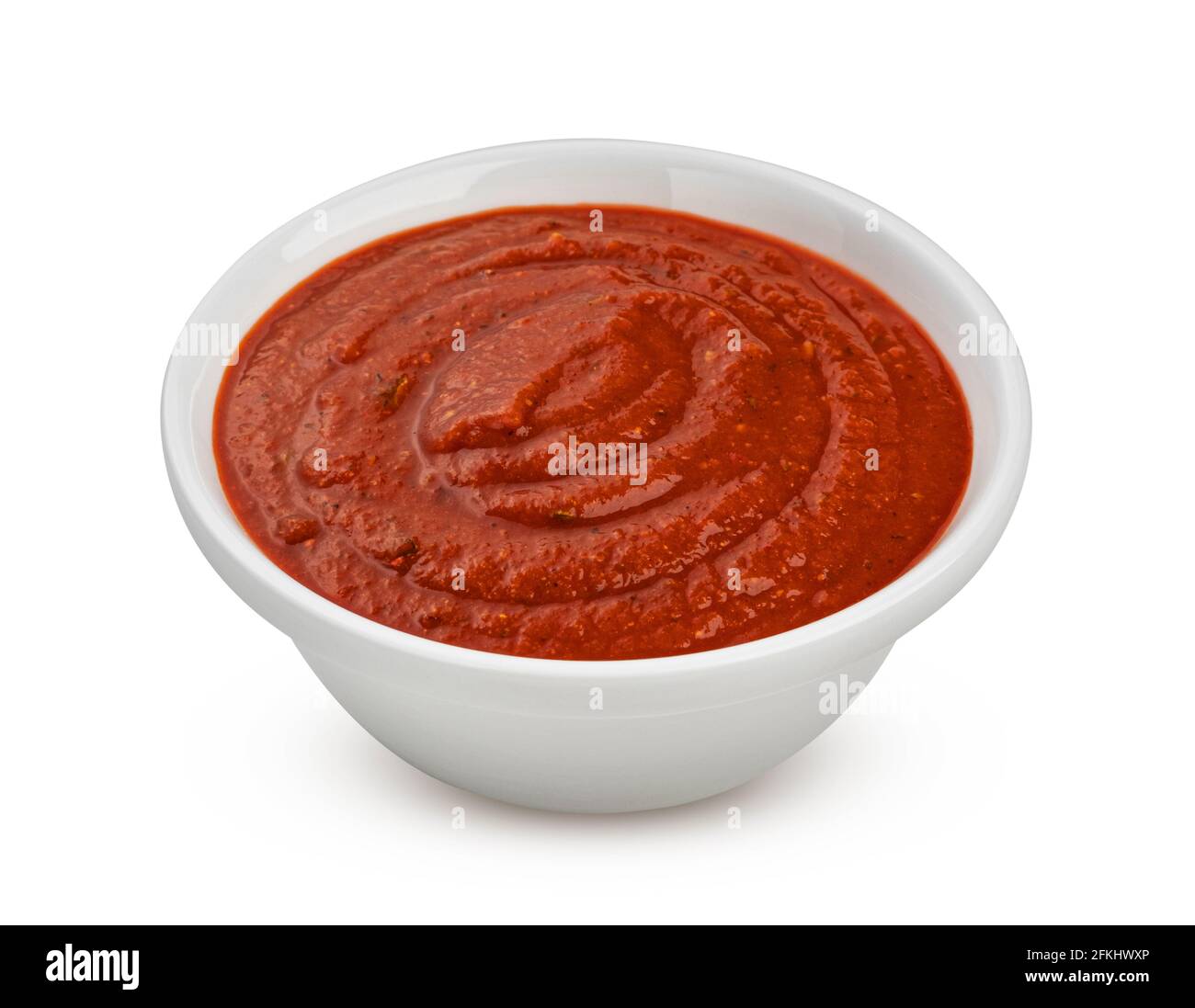 Bowl of tomato soup isolated on white background Stock Photo