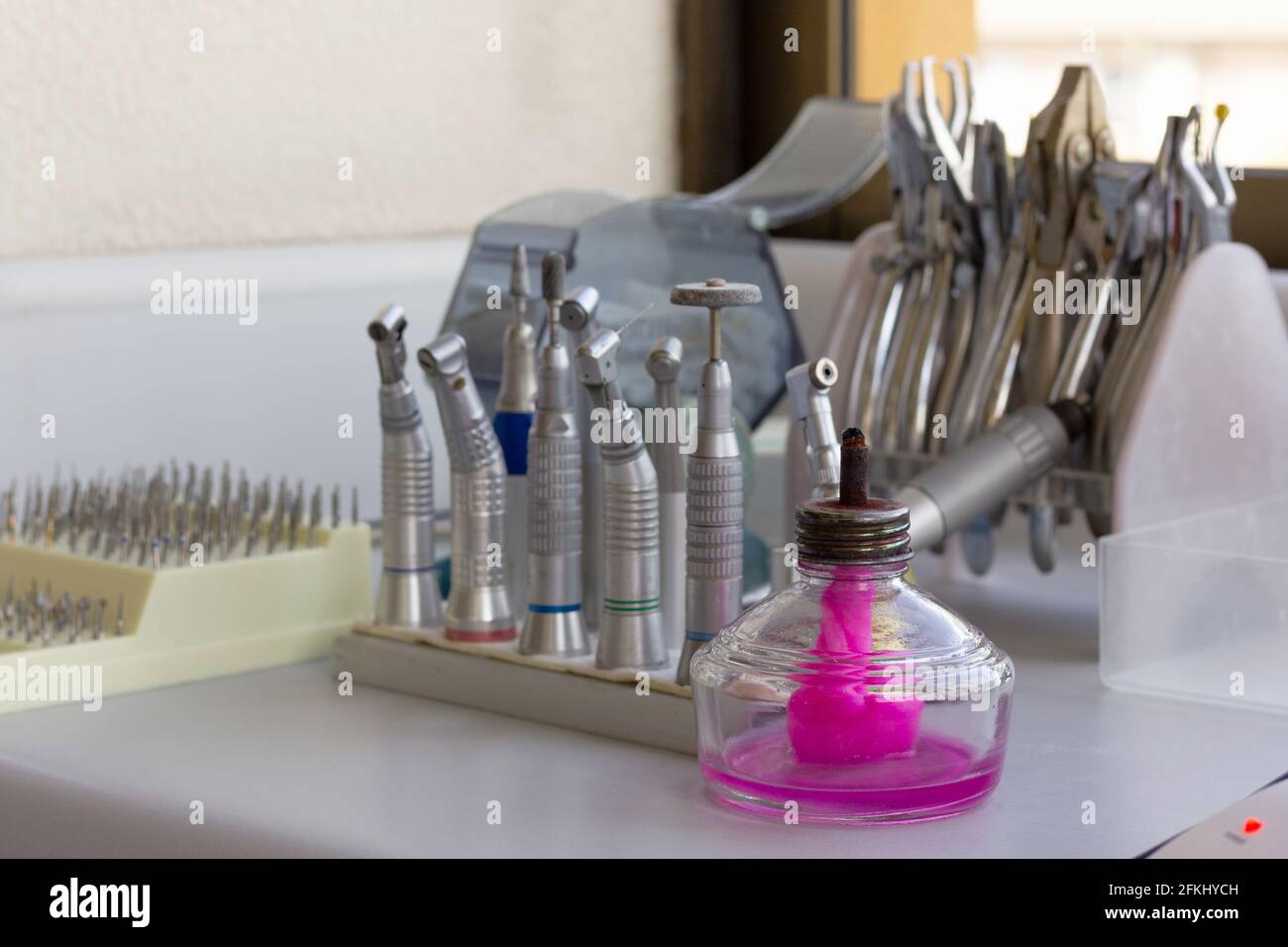 Dental clinic equipment with pink smell diffuser on table. Dentist tools concept Stock Photo