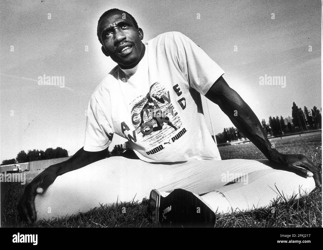 Linford Christie limbers up during training (1992) epd Stock Photo